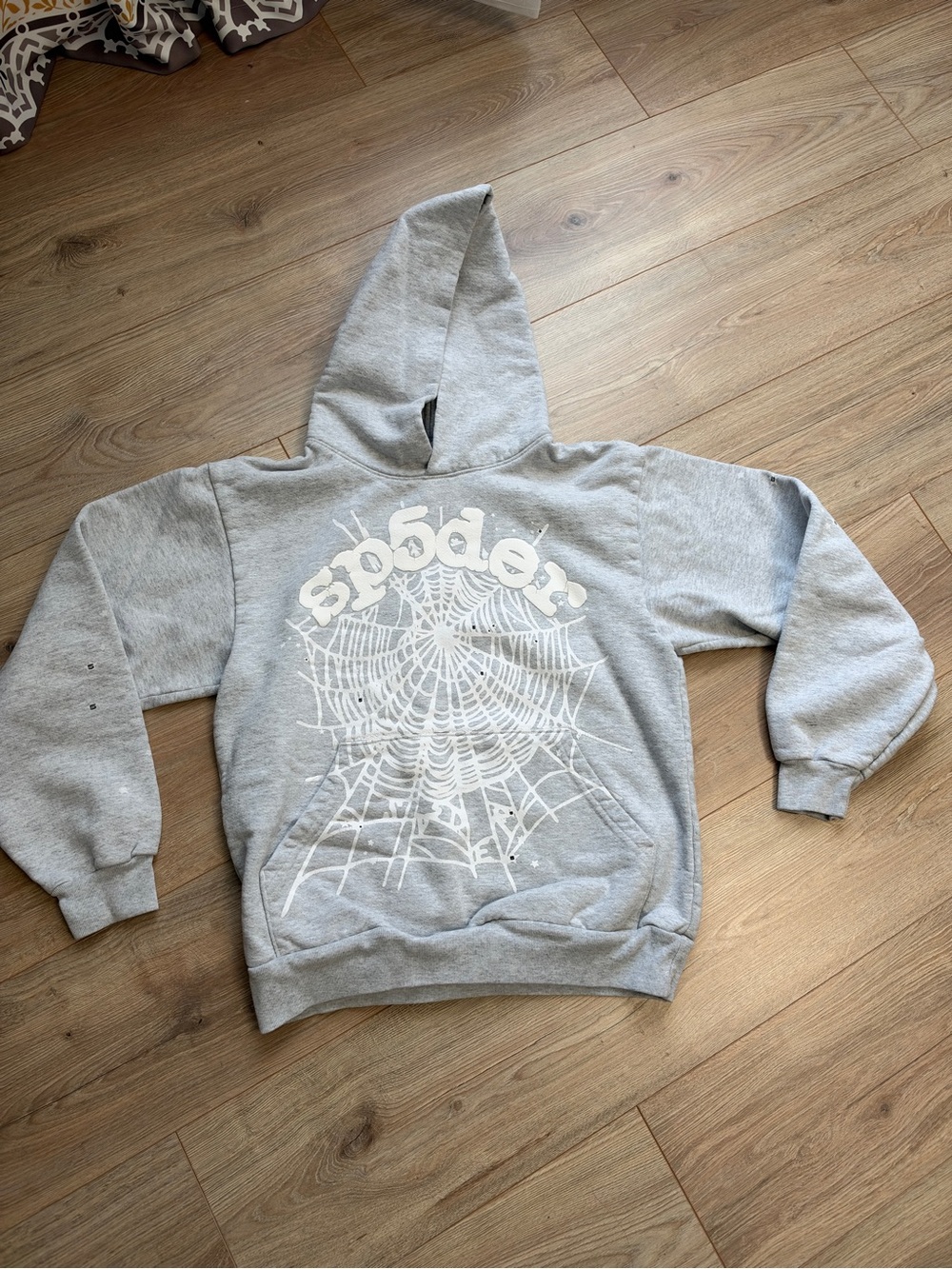 Sp5der Men's Gray Zip-Up Hoodie with White Spiderweb Graphic